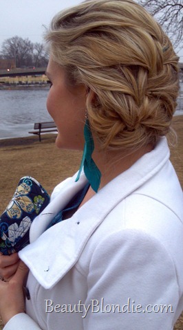Braided Up-do with Teal Feather Earings, a Vera Purse and White Coat